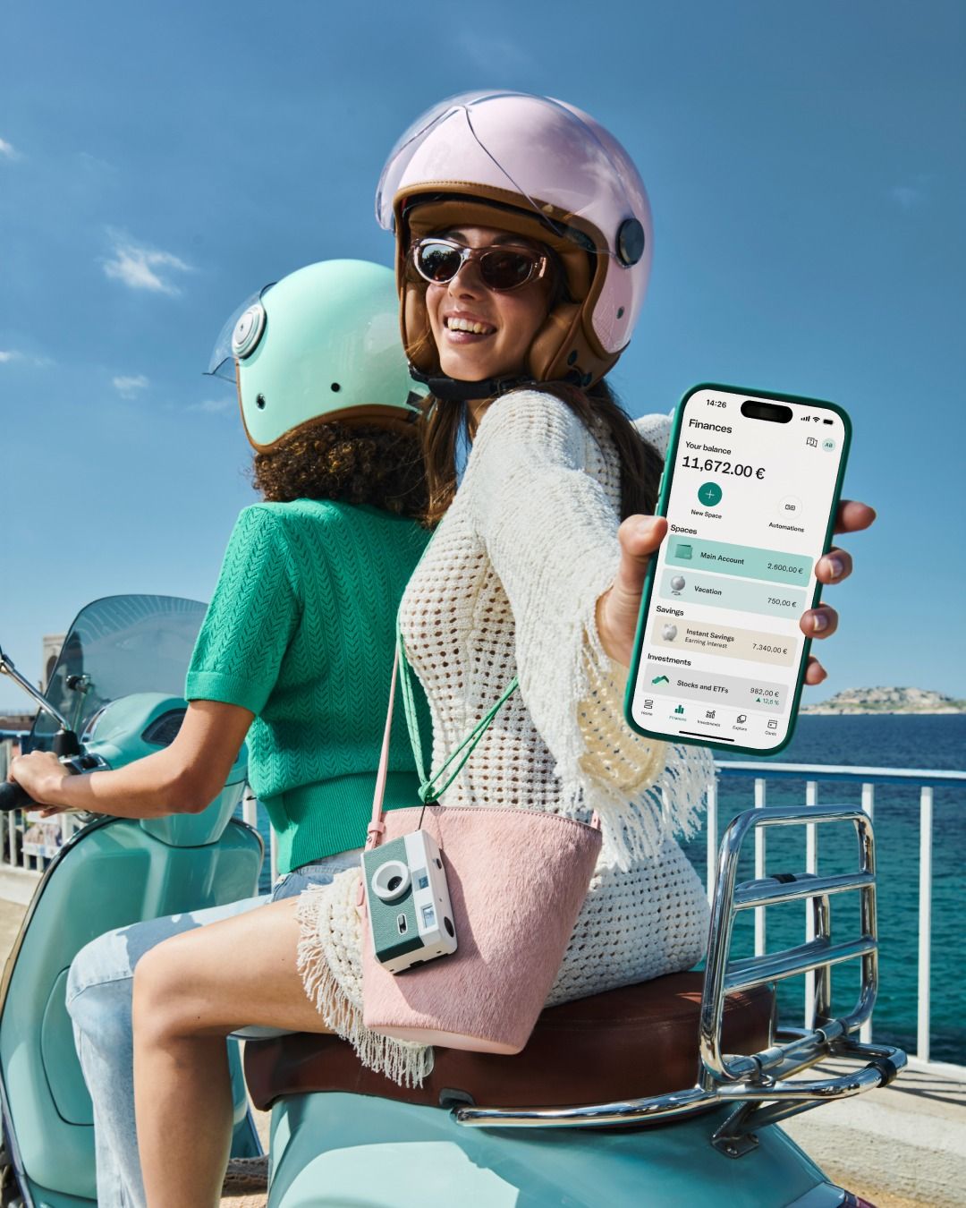 User picking up a Soudian mobile charging device